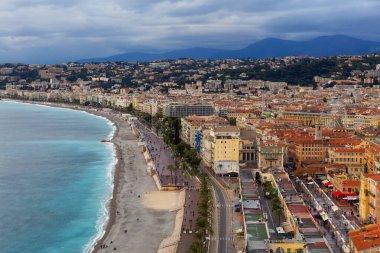 Sandy Beach by Historic City of Nice, France. View from Castle Hill. Cloudy Evening before Sunset.