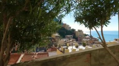 Colorful apartment homes in touristic town, Riomaggiore, Italy. Cinque Terre National Park. Slow Motion cinematic
