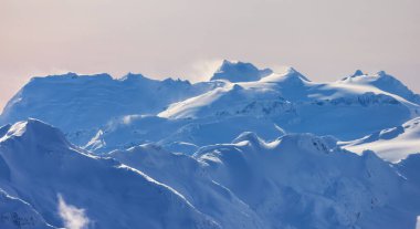 Snow and Cloud covered Canadian Nature Landscape Background. Winter Season in Whistler, British Columbia, Canada. From Blackcomb Mountain