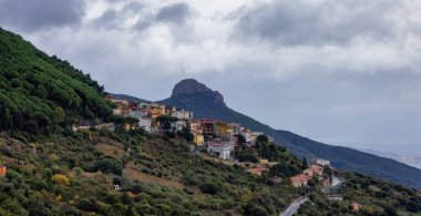 Small Touristic Town, Baunei, in the Mountains of Sardinia, Italy. Cloudy Rainy Day. Fall Season