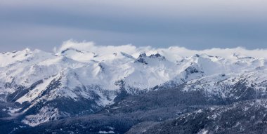 Snow and Cloud covered Canadian Nature Landscape Background. Winter Season in Whistler, British Columbia, Canada. From Blackcomb Mountain