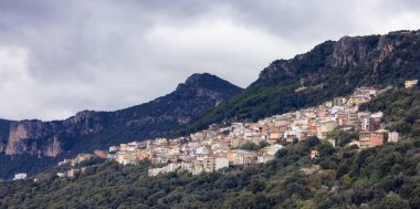 Small Touristic Town, Baunei, in the Mountains of Sardinia, Italy. Cloudy Rainy Day. Fall Season