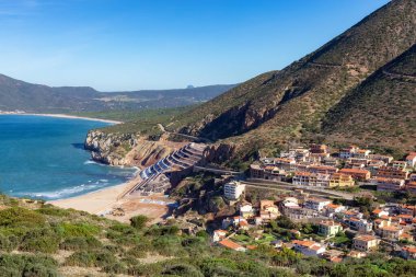 Town on the sea coast, Buggerru, Sardinia, Italy. Sunny Fall Season Day.