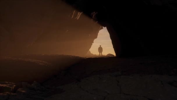 Man Standing Rocky Cave Sunrays Adventure Composite Rendering Sunny Sunset — Stock Video