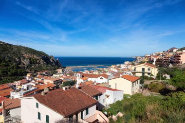 Town on the sea coast, Buggerru, Sardinia, Italy. Sunny Fall Season Day.