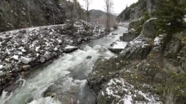 Fast pass near the river in the canyons. Canadian Nature in Winter Season. Sea to Sky, British Columbia, Canada.