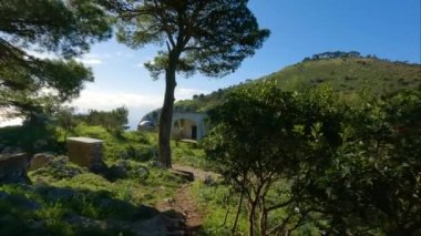 Touristic Town on Capri Island in Bay of Naples, Italy. Sunny Blue Sky. Nature Background. View from top of Mountain. Slow Motion Cinematic Pan