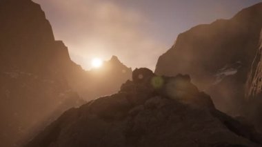 Rocky Mountain Peaks during golden sunset sky. 3d Rendering Artwork. Aerial View Background.