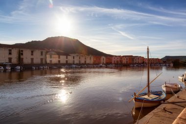 River with Homes and Apartments in Touristic Town. Bosa, Sardinia, Italy. Sunny Fall Season Day. Panorama