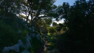 Touristic Town on Capri Island in Bay of Naples, Italy. Sunny Blue Sky. Nature Background. View from top of Mountain. Slow Motion Cinematic Pan