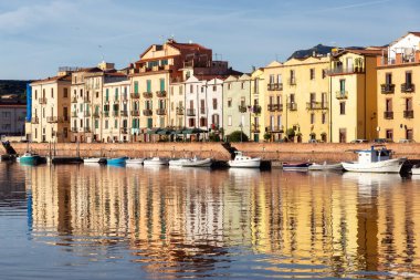 River with Homes and Apartments in Touristic Town. Bosa, Sardinia, Italy. Sunny Fall Season Day. Panorama