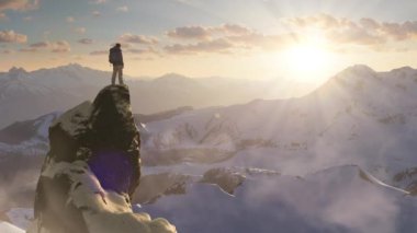 Adventurous Man Hiker standing on top of icy peak with rocky mountains in background. Adventure Composite. 3d Rendering rocks. Aerial Image of landscape from BC, Canada. Dramatic Sky. 3d Illustration