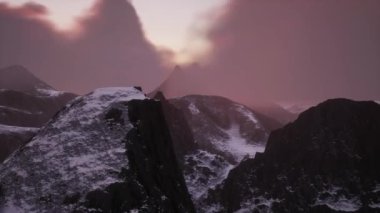 Rocky Mountain Peaks during golden sunset sky. 3d Rendering Artwork. Aerial View Background. 3D Illustration