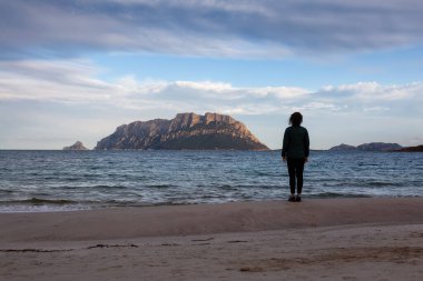Rocky and Sandy Beach in Porto Istana, Sardinia, Italy. Tavolara Island in Background. Nature