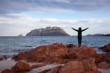 Rocky and Sandy Beach in Porto Istana, Sardinia, Italy. Tavolara Island in Background. Nature