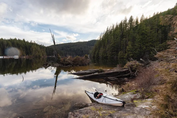 stock image Kayaking in calm water with Canadian Mountain Landscape Background. Buntzen Lake in Vancouver, British Columbia, Canada.