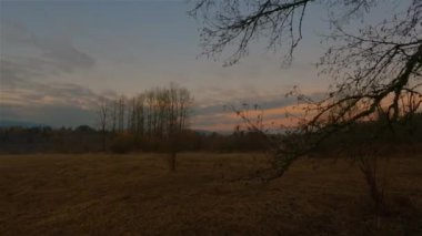 Trail by Peaceful Lake in the modern city, Deer Lake Park. Burnaby, Vancouver, BC, Canada. Colorful Winter Sunset Sky. Slow Motion Cinematic Pan