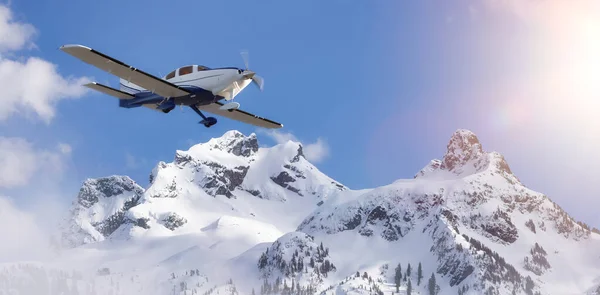 Small Airplane flying near Sky Pilot Mountain covered in Snow. Adventure 3d Rendering Plane. Canadian Landscape Nature Background. Squamish, BC, Canada.
