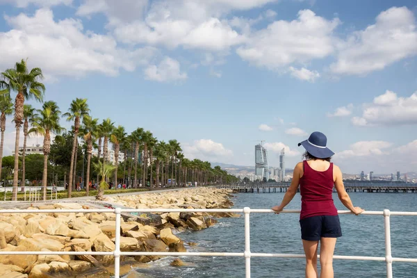 stock image Woman Traveler at Modern Cityscape on the Sea Coast. Limassol, Cyprus.