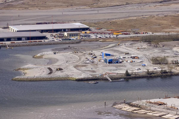 stock image Squamish, British Columbia, Canada - April 24, 2023: Aerial View of Industrial Site and Port on Pacific Ocean in Howe Sound.