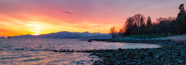 stock image English Bay Beach in Downtown Vancouver, British Columbia, Canada. Dramatic Sunset on the West Coast of Pacific Ocean. Panorama Background