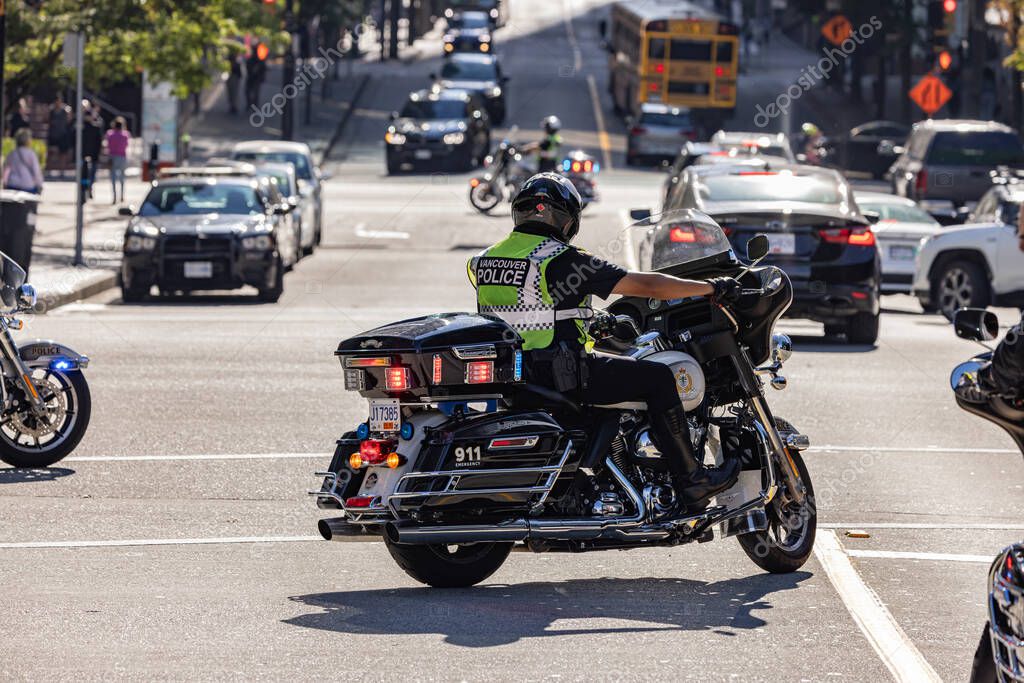 Downtown Vancouver, BC, Canada - September 20, 2023: Vancouver Police on a motorcycle supervising the protest.