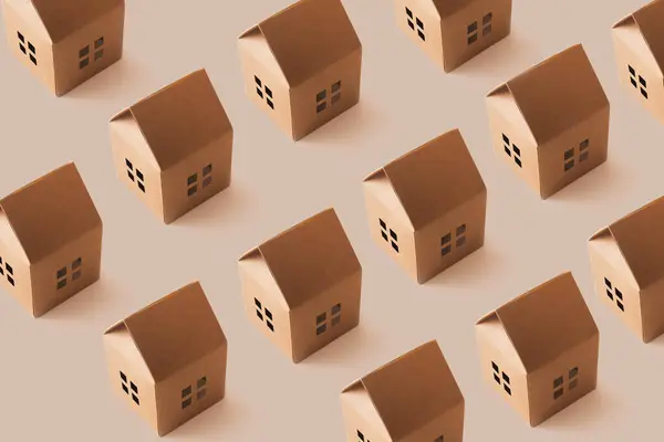 Açık bej arka planda kahverengi kağıt evlerle yapılan son moda güneş ışığı deseni. Minimum konsept.