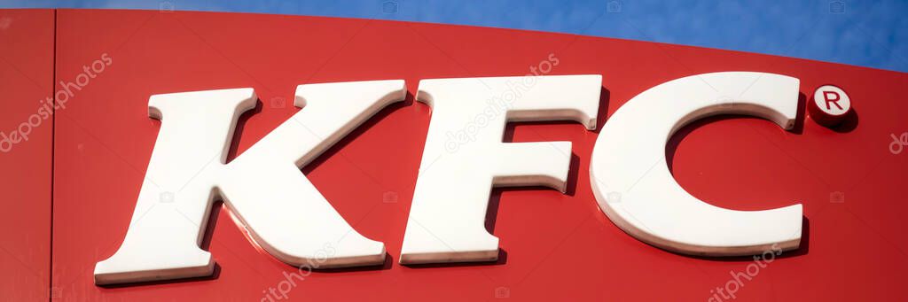 SOUTHEND-ON-SEA, ESSEX - OCTOBER 25, 2017:   Panorama of logo sign outside KFC fast food Restaurant in Sutton Road