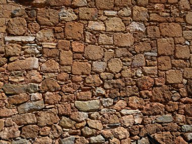Duvardaki sıcak renkli taş blokların arkaplan dokusu