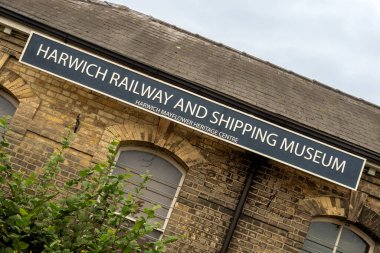HARWICH, ESSEX, UK - AUGUST 12, 2018:  Sign outside the Railway and Shipping Museum housed in the Harwich Town Railway Station Buildings
