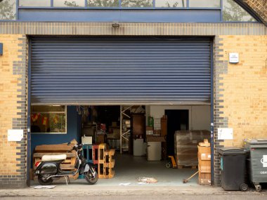 LONDON, UK - AUGUST 17, 2018:  View of small factory lockup in Southwark with roller door