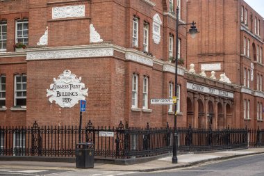 LONDON, UK - AUGUST 17, 2018:  A Guinness Trust Building in Kirby Grove, Snowfields.  One of the largest providers of affordable housing in England. 