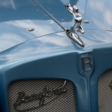 SOUTHEND-ON-SEA, UK - OCTOBER 05, 2025:  Closeup of bonnet and Silver Lady mascot ornament on Beauford vintage car
