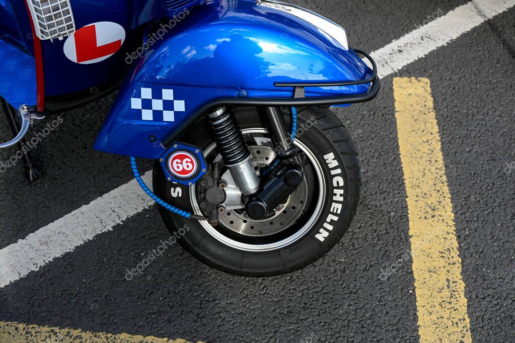 SOUTHEND-ON-SEA, UK - OCTOBER 05, 2025:   Front wheel detail with Michelin tyre on scooter