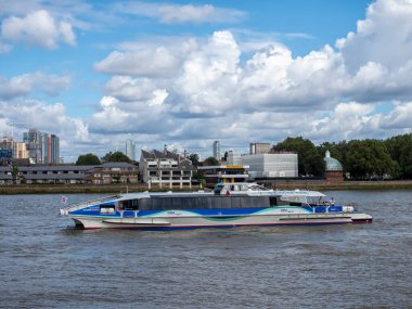 LONDON, UK - AUGUST 25, 2018:  View of an MBNA Thames Clipper River Bus on the River Thames at Greenwich