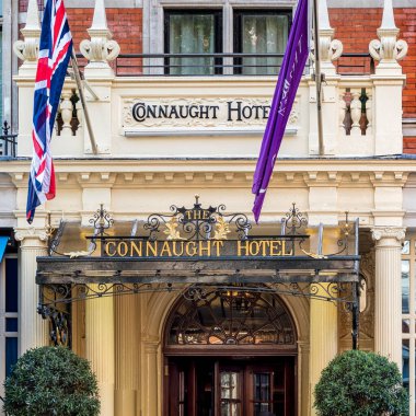 LONDON, UK - AUGUST 25, 2018:   Facade and sign on The Connaught Hotel in Carlos Place, Mayfair