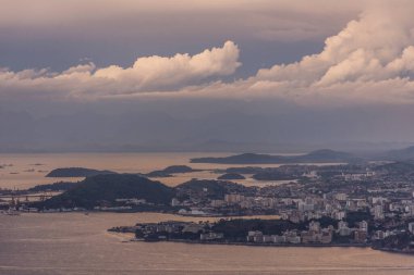 Beautiful view to bay water, buildings and sunset clouds in Rio de Janeiro, Brazil