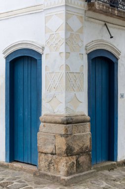 Beautiful view to masonic symbols on facade of small houses in colonial historic town, Paraty, Rio de Janeiro, Brazil