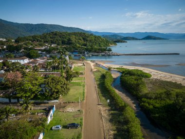 Beautiful aerial view to ocean shore small colonial town with mountains on the back, Paraty, Rio de Janeiro, Brazil