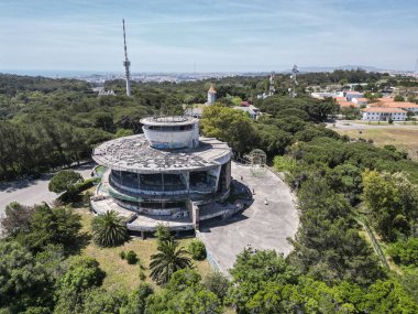Beautiful aerial view to Monsanto Park panoramic viewpoint building in Lisbon, Portugal clipart