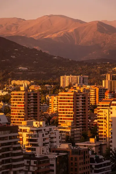 stock image Beautiful sunset view to city buildings and Andes chain of mountains on the back, Santiago, Chile