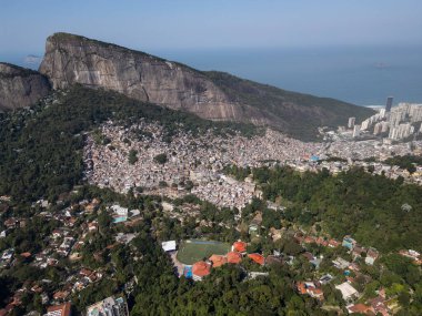 Beautiful aerial view to Rocinha favela, green rainforest and mountains in Rio de Janeiro, Brazil clipart