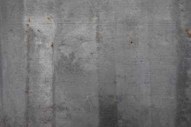 Gri tonlarda kaba metalik bir yüzey, yıpranmış kusurları ve modern veya rustik tasarımlar için endüstriyel dokuları sergiliyor..