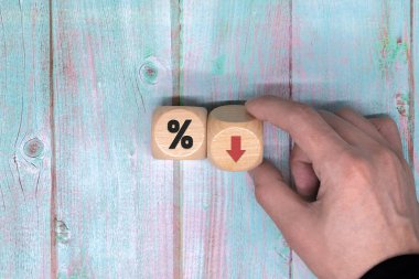 a declining trend in interest rates It symbolizes that interest rates are falling or vice versa. a business concept make a copy of a blank