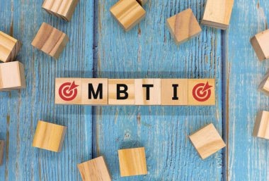 Four wooden blocks with the letter MBTI, Myers-Briggs Type Indicators clipart