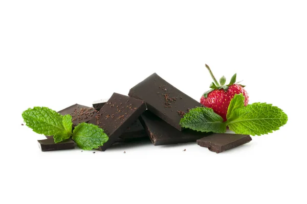 stock image   A beautiful still life of dark chocolate, juicy strawberries and green mint leaves.