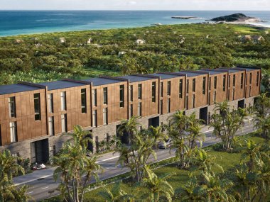 Üç boyutlu modern tropik konak kompleksi bronz cepheli ve palmiye ağaçlı. Okyanus manzaralı. Minimalist dış mimari, emlak ve tasarım temaları için mükemmel..