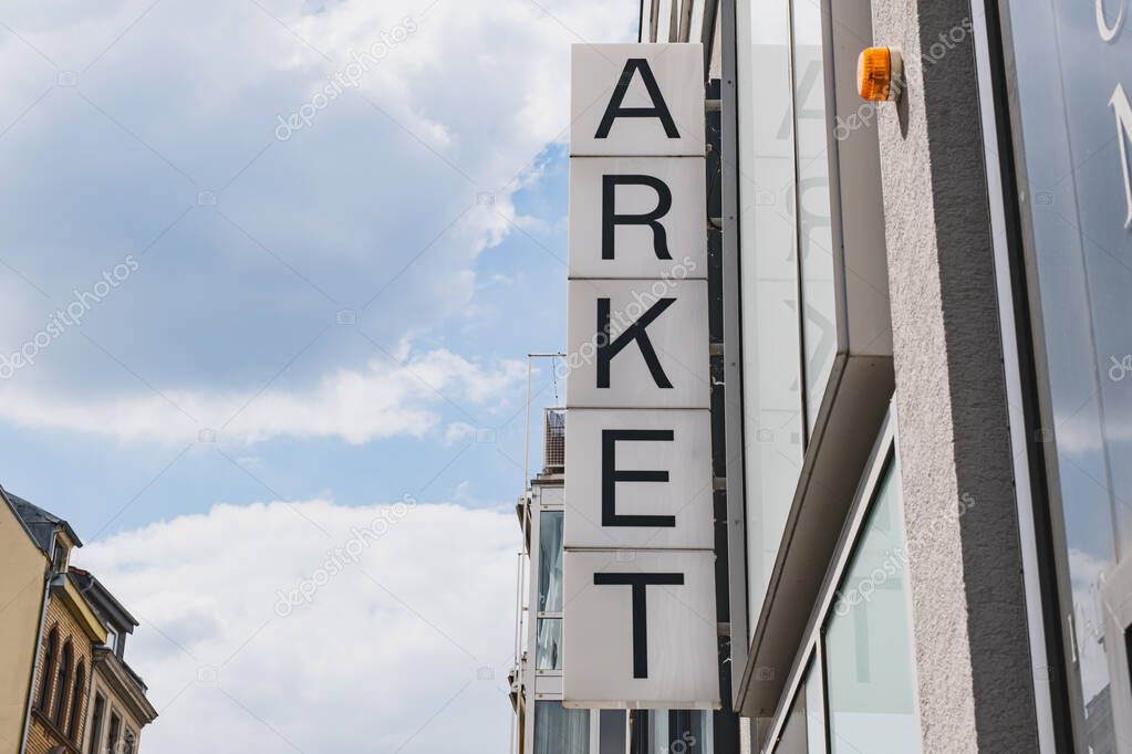 ARKET clothing store logo on the side of a building