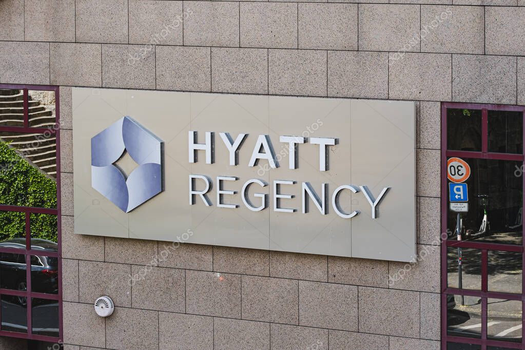 Hyatt Regency hotel sign on an office building wall