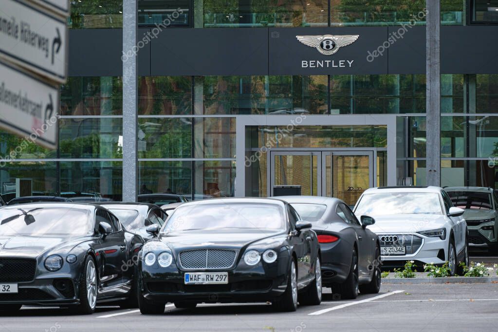 Luxury Bentley showroom with premium cars parked in front